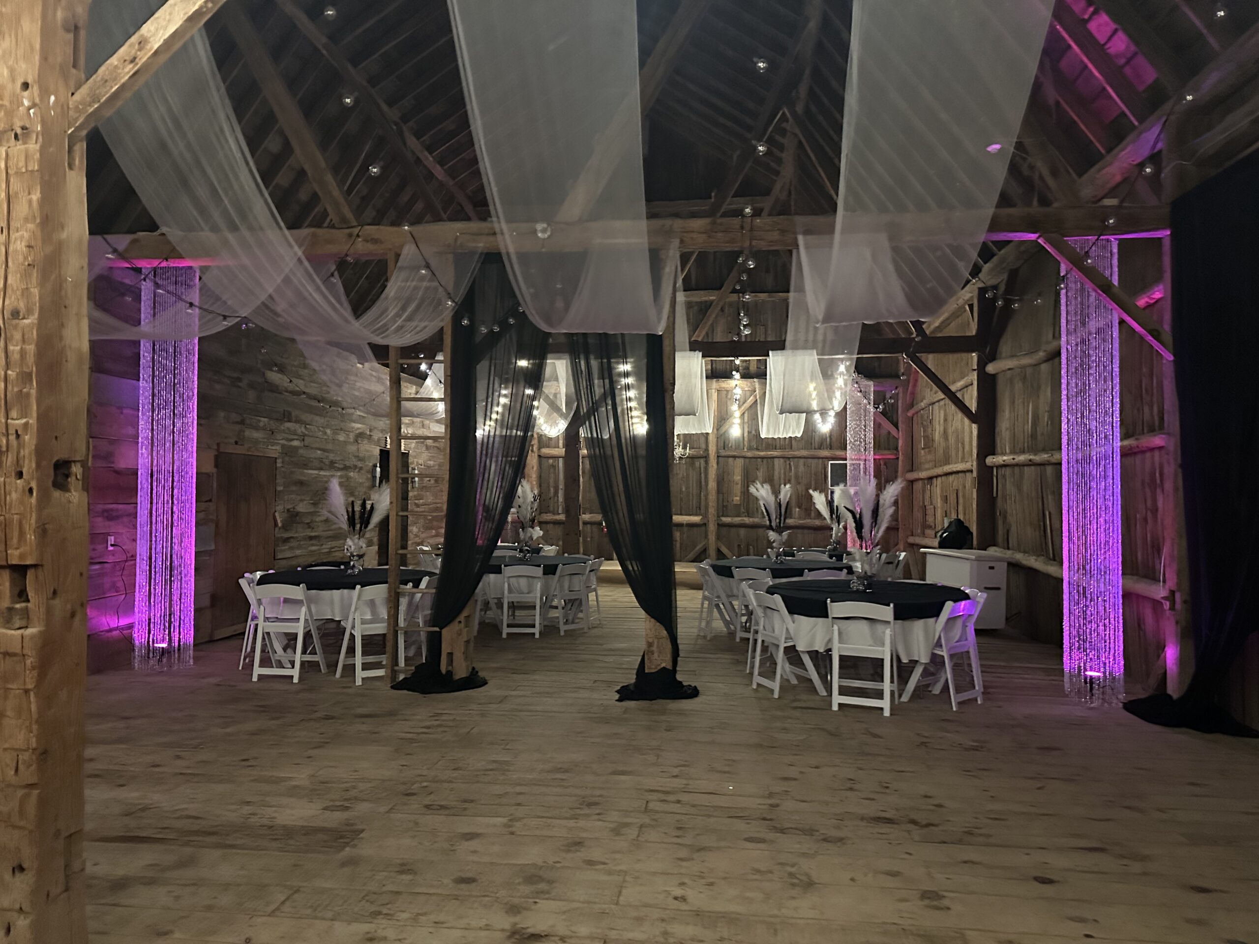 Rustic farm dining room with long tables.